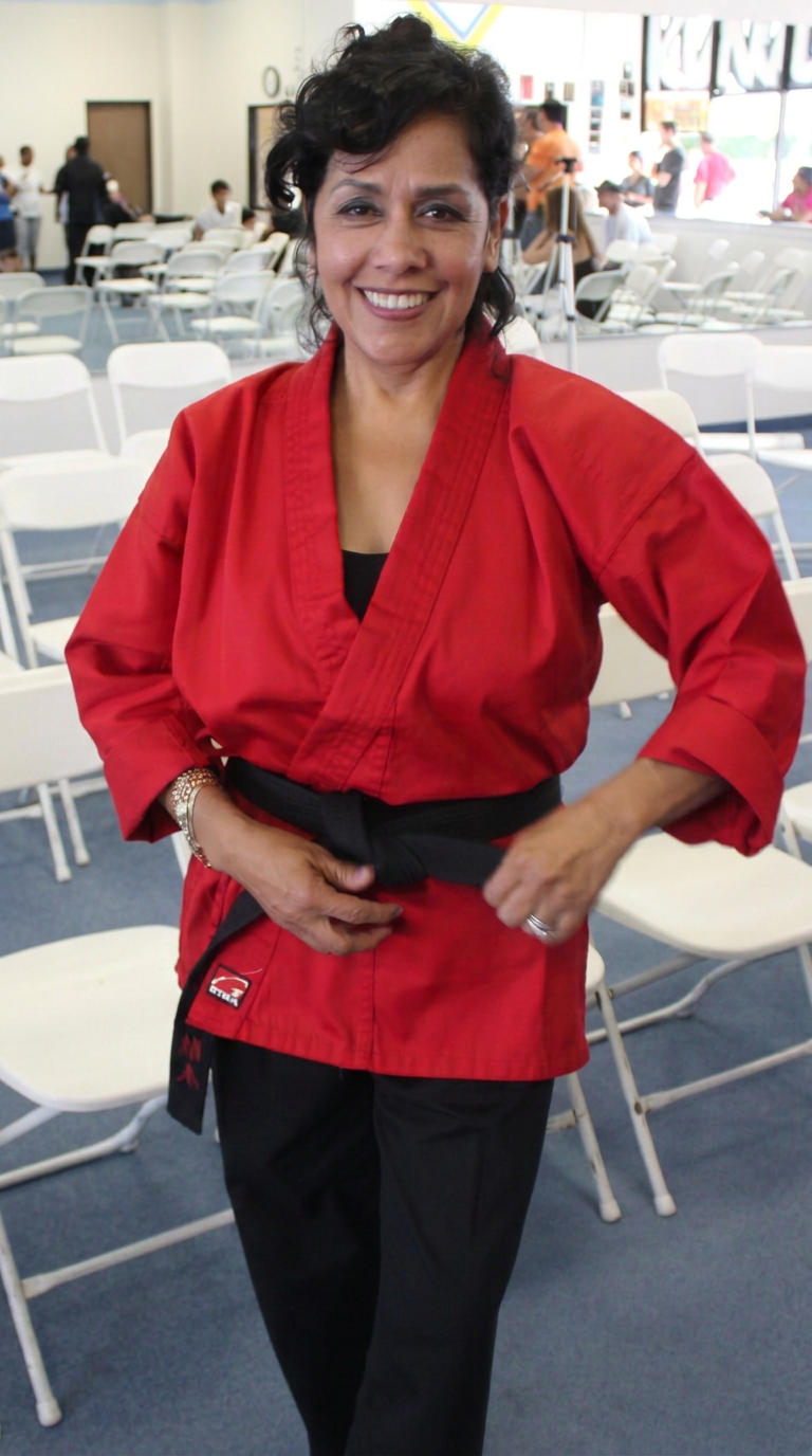 Frances Walker in her red martial arts uniform at Braveheart Kung Fu San Soo in Heath, TX